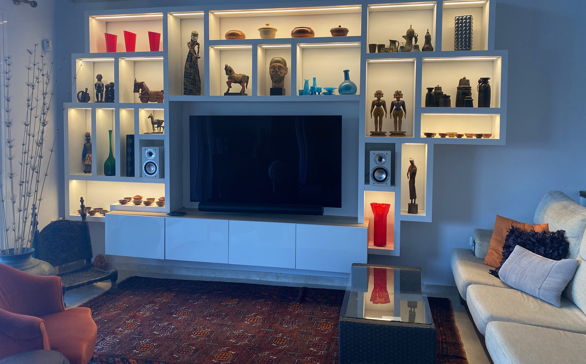 To showcase the sculptures and art, a custom-built shelving unit was designed by Christopher and Ann Jenkins and built by Christopher Jenkins and Michael Vogt.